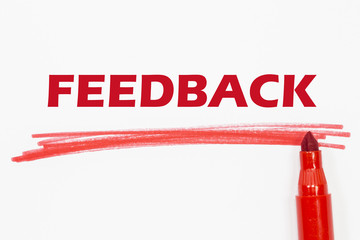 FEEDBACK word written with red marker