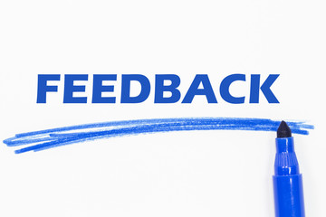 FEEDBACK word written with blue marker