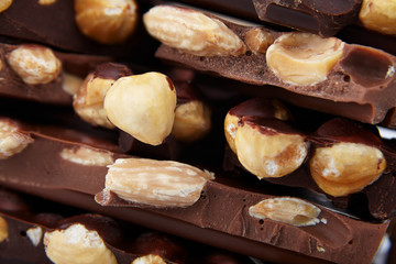 pieces of chocolate with nuts, close-up delicacy