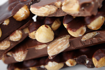 pieces of chocolate with nuts, close-up delicacy