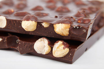 pieces of chocolate with nuts, close-up delicacy