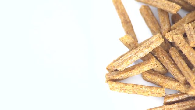 Portion of rotating Bread Chips as seamless loopable 4K UHD footage