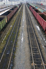 Obraz premium Railway station in winter and freight trains