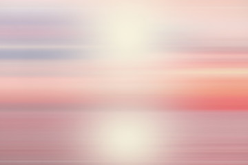 Peaceful Abstract blur beautiful purple ocean with pink sky sun background.