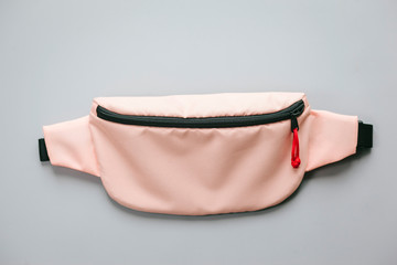 Waist bag of banana of scarlet colour on a white background isolation