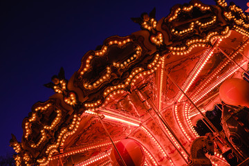 beautiful bright carousel in amusement park,night
