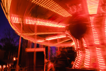 beautiful bright carousel in amusement park,night