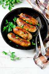 Homemade sausages from turkey (chicken) fried in a frying pan