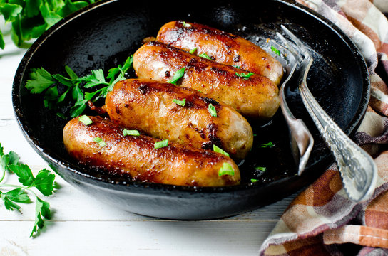 Homemade Sausages From Turkey (chicken) Fried In A Frying Pan