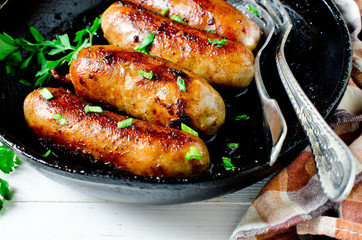 Homemade sausages from turkey (chicken) fried in a frying pan