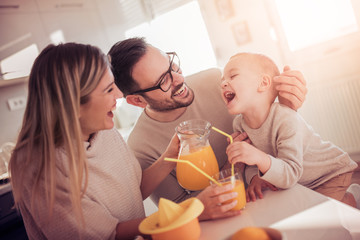 Family making juice in their kitchen