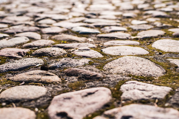 Ancient cobblestone road in close-up