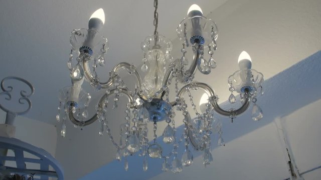 beautiful crystal chandelier wobbles