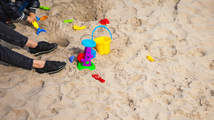 Fototapeta na wymiar Play with baby on beach in sand