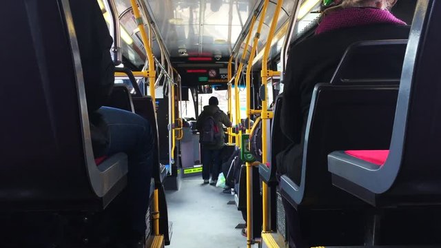 Passenger POV interior bus arriving at transit station