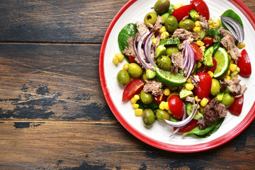 Tuna salad with vegetable and olive oil.Top view with copy space.