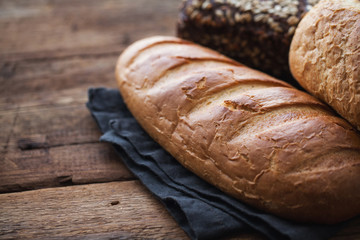 Fresh bread on a old rustic wooden table