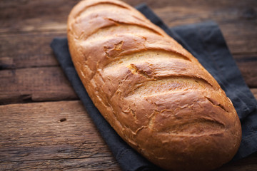 Fresh bread on a old rustic wooden table