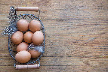 Basket ot eggs on wood background