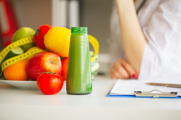 Some Fruits Such As Apples, Kiwis, Lemons And Berries On Nutritionist Table