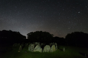 Dolmen of the Great Oak. Night landscape with ancient prehistoric dolmen. Montehermoso....