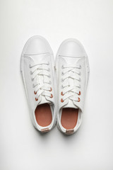 Pair of casual shoes on white background