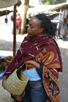 Woman holding a basket in the market