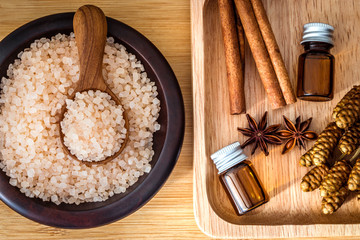 Close up brown organic Himalayan rock salt spa and cinnamon essential oil aroma set on  table , healthy spa relaxation concept