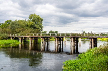 Fototapeta na wymiar Rural bridge and river