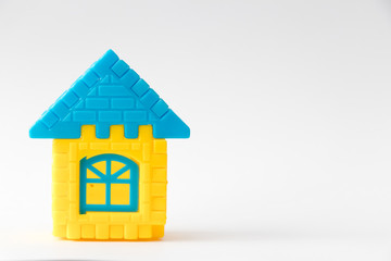 Toy puzzle connect as house shape on white background (Concept for dream home or property loan investment)