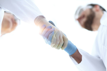 closeup.two scientists shake hands.