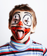 little cute real boy with facepaint like clown, pantomimic expre