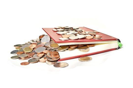 Stack coins flowing out from the red book on white background,Success of literacy education,Business and finance  
