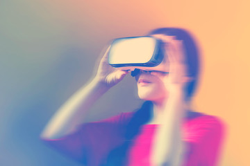 Asian woman using a new virtual reality headset
