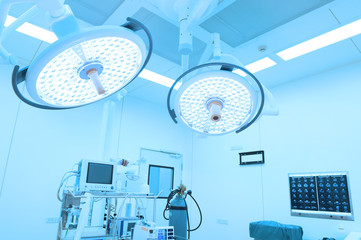 equipment and medical devices in modern operating room take with art lighting and blue filter