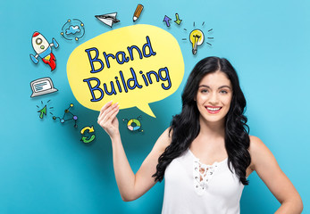 Brand Building with young woman holding a speech bubble