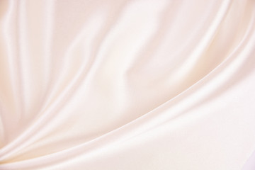 The texture of the satin fabric of pink color for the background  
