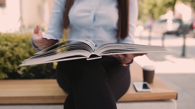 Young Business Woman Reading Book Outdoor