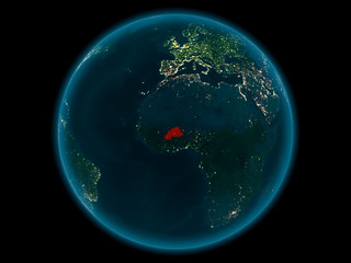 Burkina Faso on planet Earth in space at night
