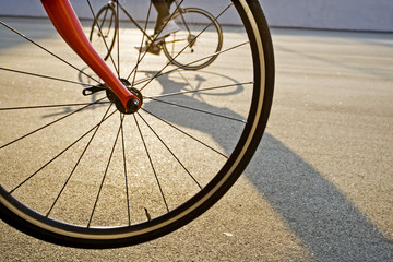 Fototapeta na wymiar bicycle wheel in the evening