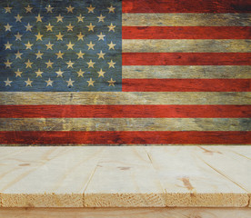 Fototapeta na wymiar wooden table on USA flag background celebrate American Independence Day of 4th July
