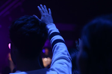 Fototapeta na wymiar Blurry Background , Worship Christian Rock Concert , Hands Up