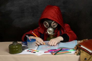 Schoolboy in a gas mask