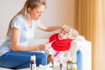 Mother at home with her sick daughter