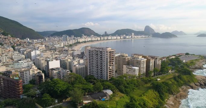 Aerial view of Rio de Janeiro flying towards Copacabana Beach and Sugarloaf mountain, Brazil. Morning light