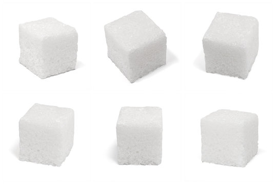 six 6 square cubes of sugar macro isolated on white