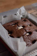Freshly baked brown bananobred in a special box for baking.