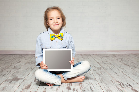 Girl playing laptop computer