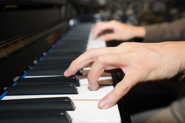 Obraz premium Musician playing piano her hands on piano keys, Playing classic piano