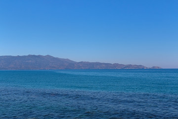 Plakat Greek coast, mountains, sea, sky, sun.